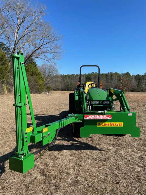 Limb Beaver Baby Beaver BB 4TR on a tractor loader, boom raised