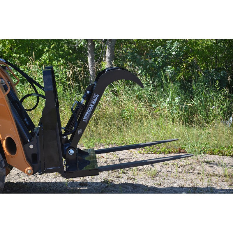 Top Dog Attachments pallet fork grapple bolted to skid steer pallet forks, side view