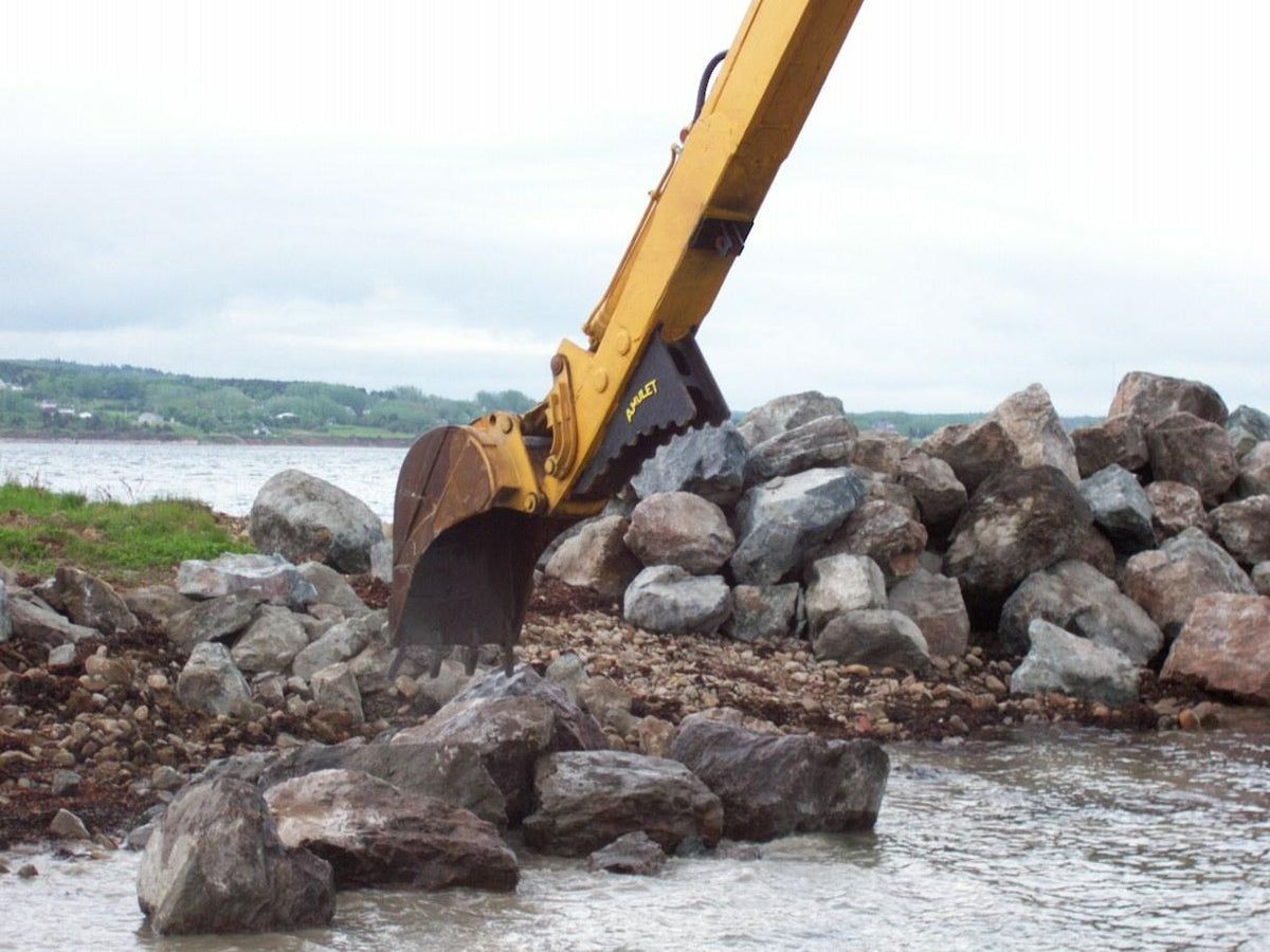 Amulet StickGrip handling rock on an excavator