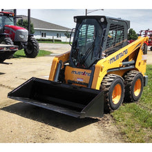 Berlon Industries B Series low profile skid steer bucket on a Mustang skid steer