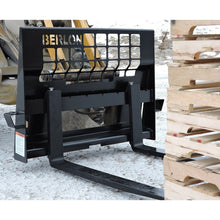 Berlon Industries Class II pallet forks beside a stack of pallets