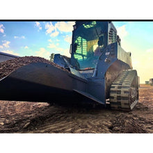 Berlon Industries gravel spoon on a track loader at a stone pile