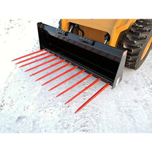 Berlon Industries manure fork on a skid steer in snow