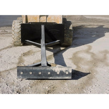 Berlon Industries material pusher on a loader at a gravel yard