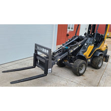 Berlon Industries mini pallet forks, side view on a loader