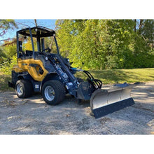 Berlon Industries snow blade on a compact articulated loader