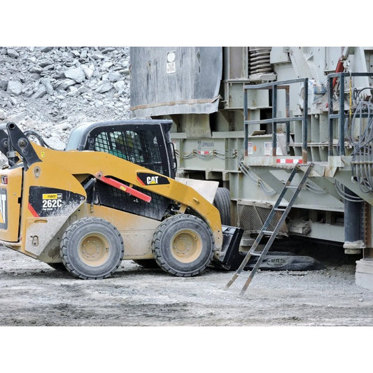Berlon Industries MLB material long bucket on a CAT skid steer at a quarry conveyor