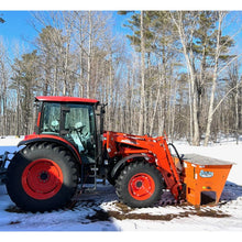 Berlon Industries salt spreader on a red tractor loader in snow