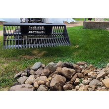 Berlon Industries skeleton bucket above a pile of picked rock