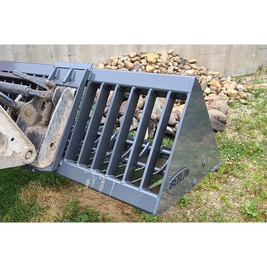 Berlon Industries SKL skeleton rock bucket lowered on a skid steer