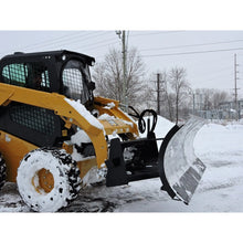 Berlon Industries snow blade angled on a CAT skid steer in snow
