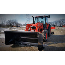 Berlon Industries snow pusher on a red tractor loader