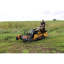 Berlon Industries soil conditioner on a mini track loader on a hill