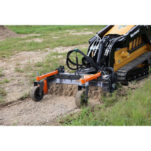 Berlon Industries mini soil conditioner working a strip of soil on a Vermeer mini skid steer