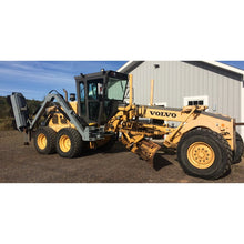Forax Equipment grader implement boom raised beside the cab of a road grader