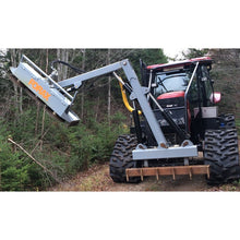 Forax Equipment groomer boom brush cutter on a tracked tractor brushing a wooded trail edge