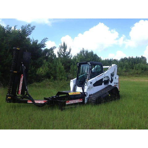 Limb Beaver LB 6SS skid steer limb and brush cutter on a compact track loader, side view in a field