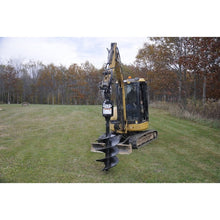 Lowe Manufacturing BP Series auger standing on a compact excavator in a field