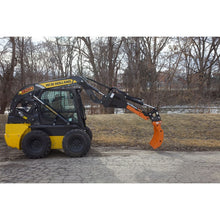 Lowe Manufacturing OptiBoom MAX with the rake on a New Holland skid steer