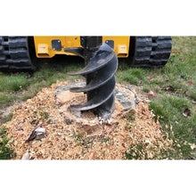 Lowe Manufacturing stump planer cutting into a stump, close up
