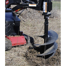 Lowe Manufacturing TJ-101 auger drilling a hole with a mini loader