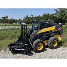 Maxx Attachments 20 inch Ranch Axe tree shear with the shear arms closed on a New Holland skid steer