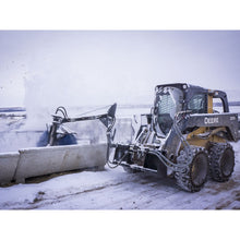 Maxx Attachments bunk sweeper clearing snow from a feed bunk