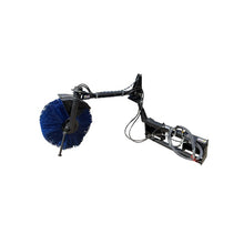Maxx Attachments feed bunk sweeper with a 36 inch poly bristle broom on its adjustable arm