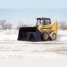 Maxx Attachments rollout bucket on a Gehl skid steer in the snow