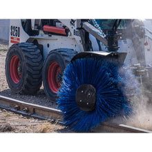 Maxx Attachments sweeper cleaning a rail siding on a Bobcat skid steer