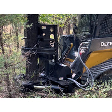 Maxx Attachments Timberwolf tree shear gripping a tree with its grapple arms on a John Deere compact track loader