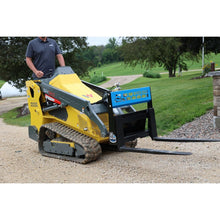Rock Solid Attachments mini pallet forks on a mini track loader