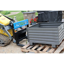 Rock Solid Attachments mini pallet forks lifting a steel bin on a pallet