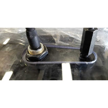 SHIELDS Bobcat R-Series door window with the original wiper hardware in its milled pocket, close-up view