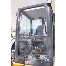 SHIELDS window installed on a John Deere compact excavator cab, front view