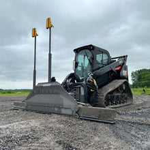 Skeer MCR ProPlus grading blade with two laser receivers on a compact track loader, working view