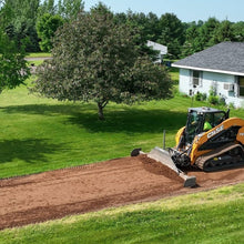 Skeer Side Plate Kit holding dirt in front of a ProPlus blade on a compact track loader, aerial working view