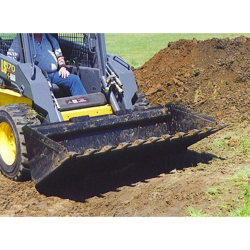 Star Industries extreme duty bucket loading dirt on a New Holland skid steer