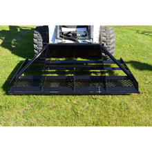 Top Dog Attachments 79 inch land plane in front of a skid steer on the grass