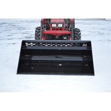 Top Dog Attachments 84 inch snow bucket on a compact tractor loader in the snow