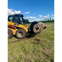 Top Dog Attachments brush grapple on a Cat skid steer carrying a log