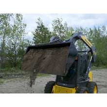 Top Dog Attachments dirt bucket dumping a load on a New Holland skid steer