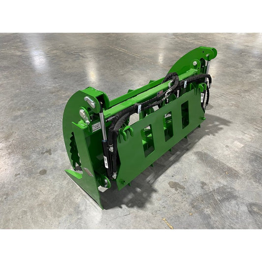 Top Dog Attachments Granite grapple with the John Deere quick attach, painted green, three quarter view