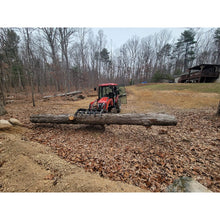 Top Dog Attachments Granite grapple on a compact tractor moving a log