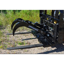 Top Dog Attachments pallet fork grapple on pallet forks, three quarter view of the grapple tines