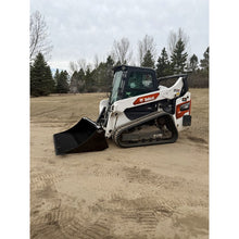 Top Dog Attachments rock bucket on a Bobcat compact track loader