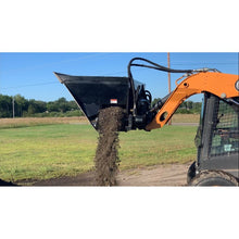 Top Dog Attachments side flow bucket spreading material out of its side opening
