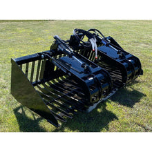 Top Dog Attachments skid steer firewood grapple on the grass, front three quarter view