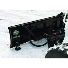 Top Dog Attachments hydraulic snow blade on a skid steer in the snow, angle cylinders and springs in view