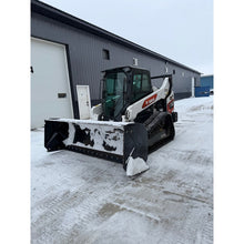 Top Dog Attachments snow pusher on a Bobcat compact track loader in the snow